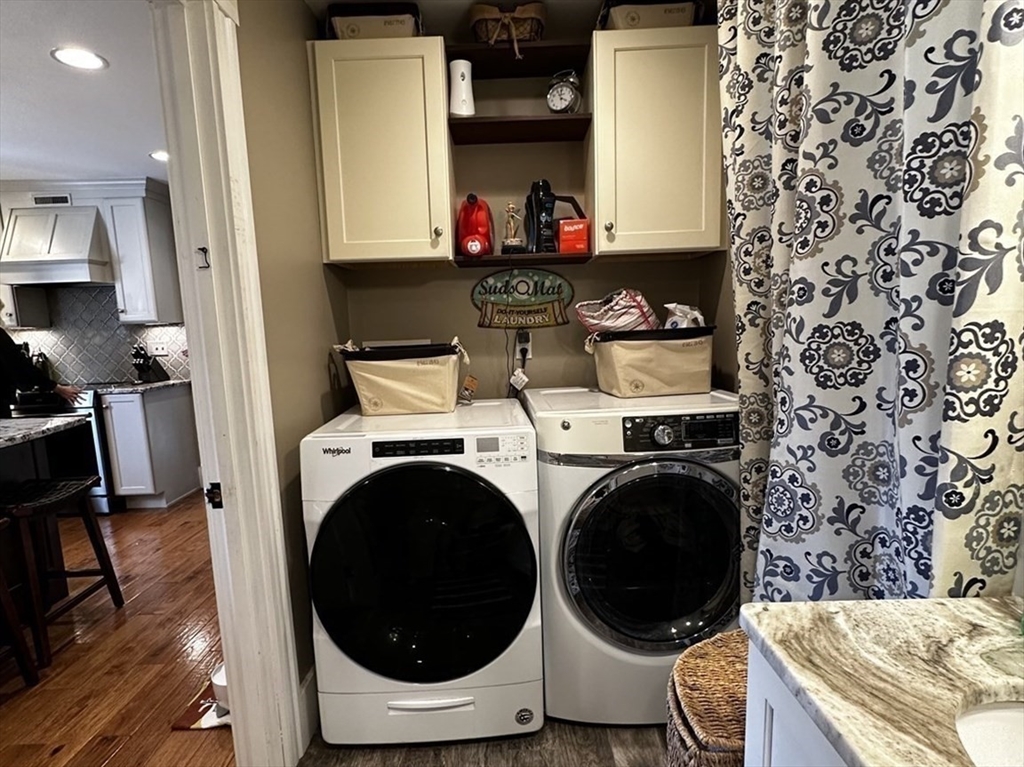 131 Pleasant Valley Street Methuen, MA 01844 - Photo 16 of 23 a view of washer and dryer in a utility room