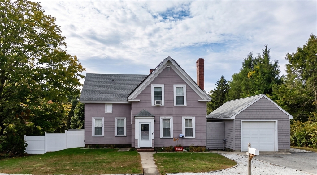 131 Pleasant Valley Street Methuen, MA 01844 - Photo 2 of 23 a front view of a house with garden