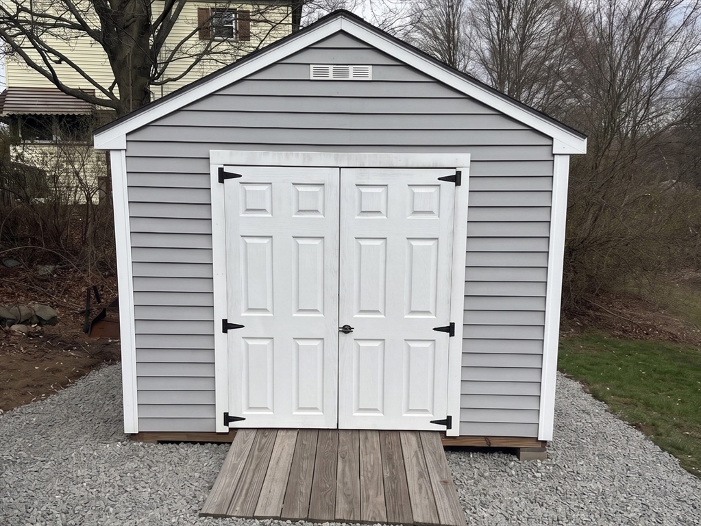131 Pleasant Valley Street Methuen, MA 01844 - Photo 22 of 23 a front view of a house with a yard