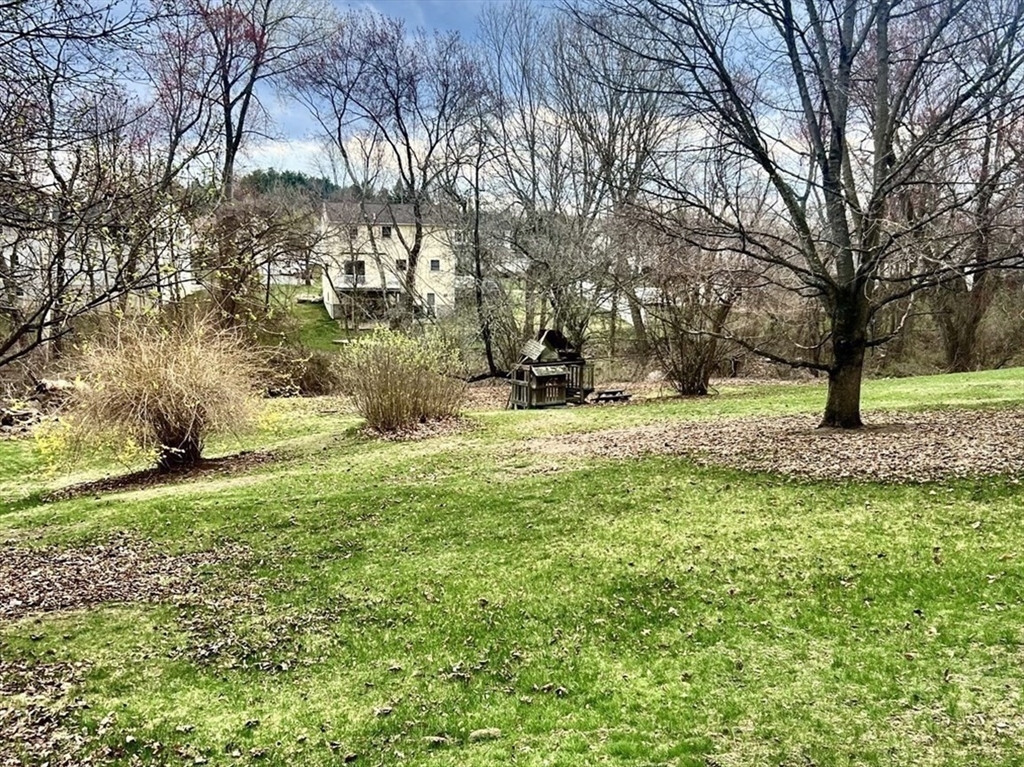 131 Pleasant Valley Street Methuen, MA 01844 - Photo 23 of 23 a view of outdoor space with garden and trees