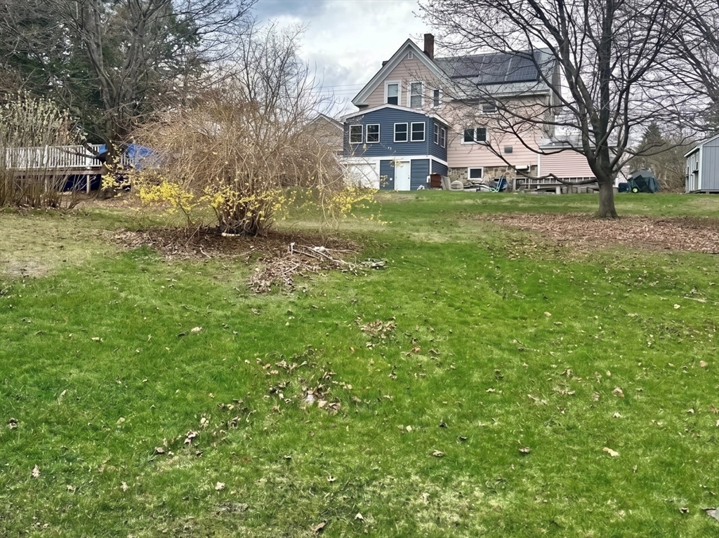 131 Pleasant Valley Street Methuen, MA 01844 - Photo 3 of 23 a view of a house with a yard