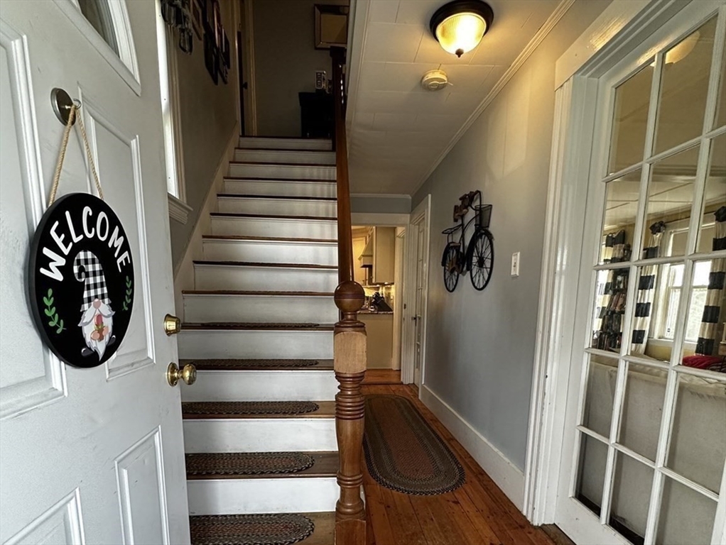 131 Pleasant Valley Street Methuen, MA 01844 - Photo 6 of 23 a view of entryway and hall with wooden floor