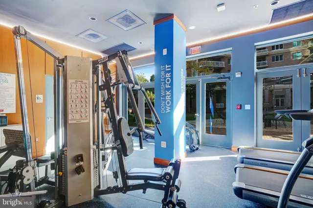 a view of a living room with furniture and a window