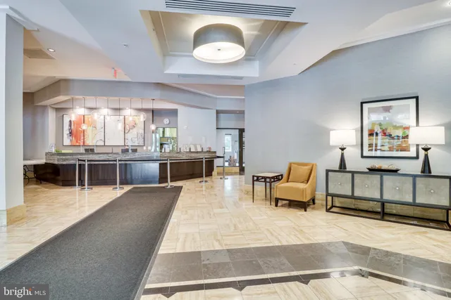 a lobby with furniture and window