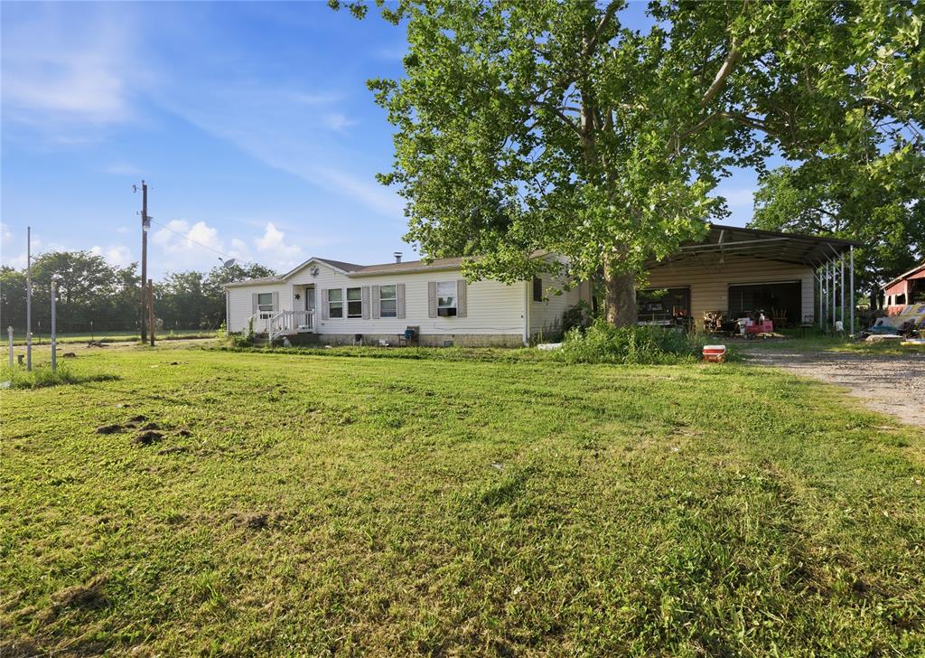 2449 East Fm 120 Denison, TX 75021 - Photo 5 of 30 a view of a house with a yard