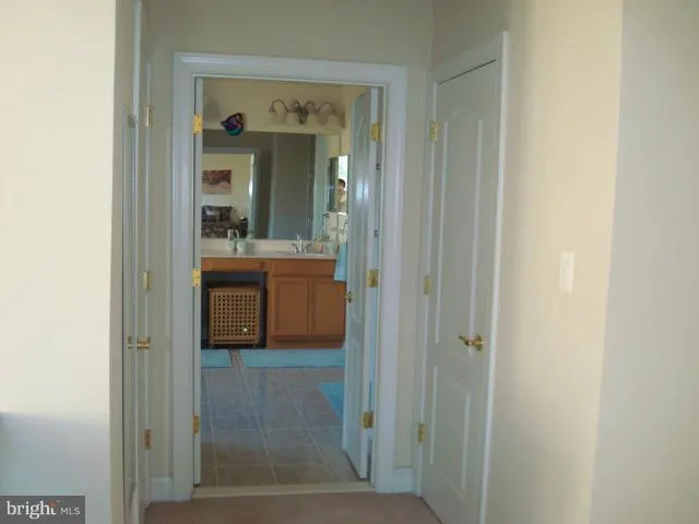 a en suite bathroom with a sink and mirror