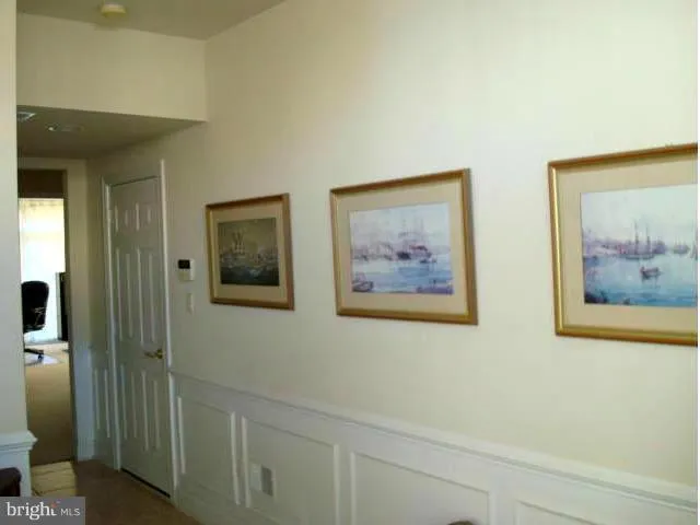 a view of a hallway with front door