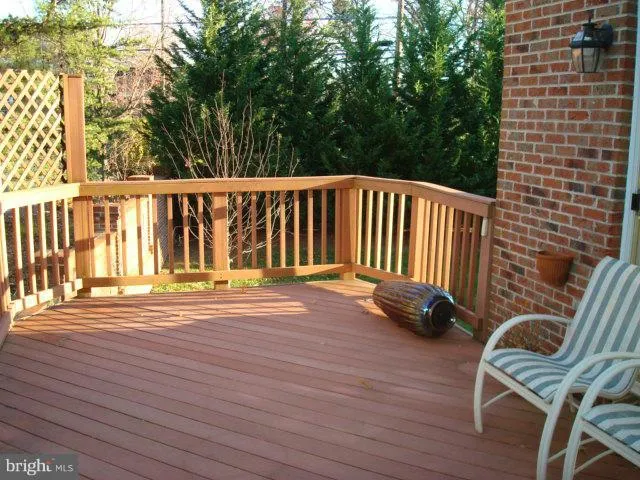 a view of a chairs on wooden deck
