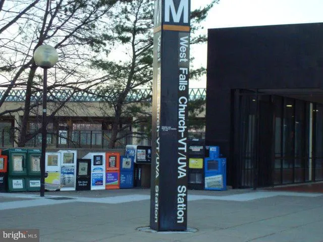 a building view with tall trees