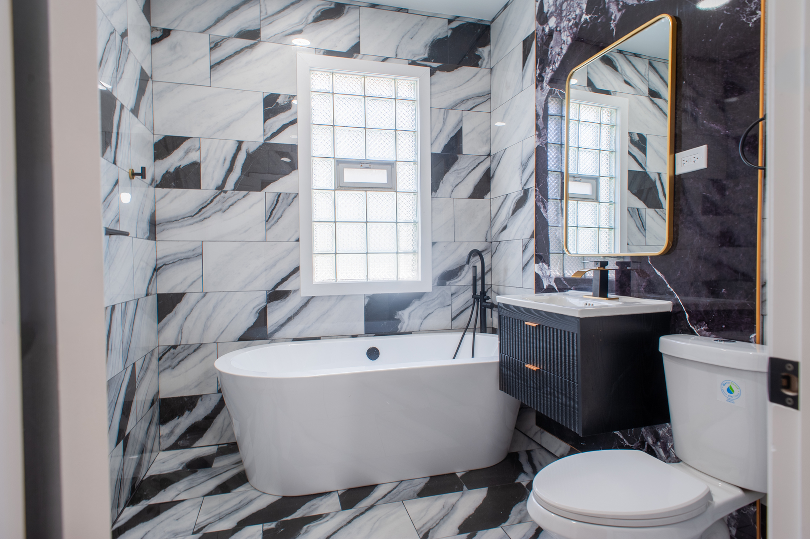 8620 South Union Avenue Chicago, IL 60620 - Photo 17 of 41 a white bath tub sitting next to a white toilet