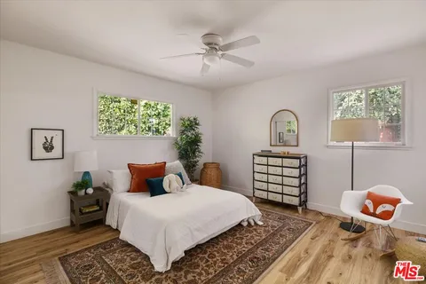 a bedroom with a bed and dresser