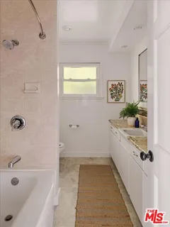 a bathroom with a bathtub and shower