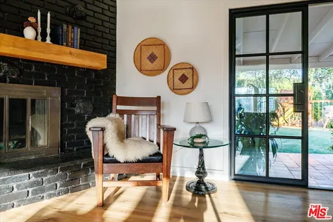 a view of a yard with potted plants