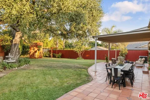 a view of a park with large trees