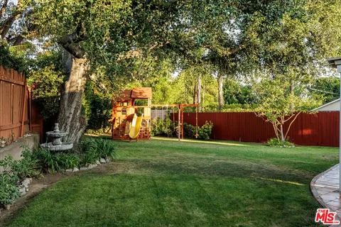 an outdoor space with lots of trees