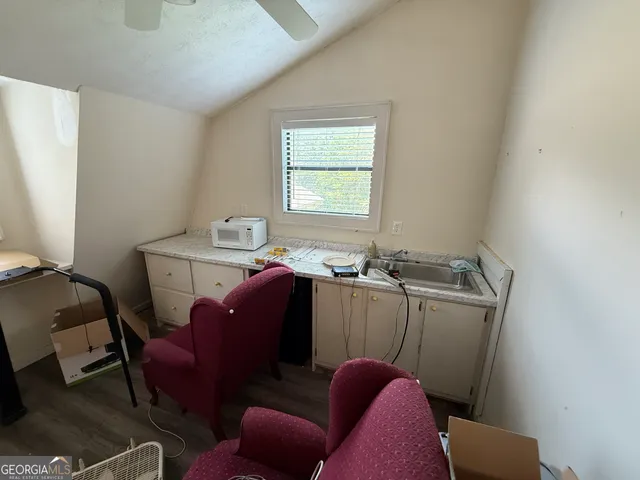 a view of workspace with furniture and window