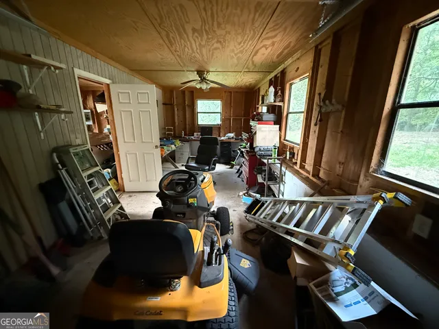 a living room with lots of furniture and a chandelier