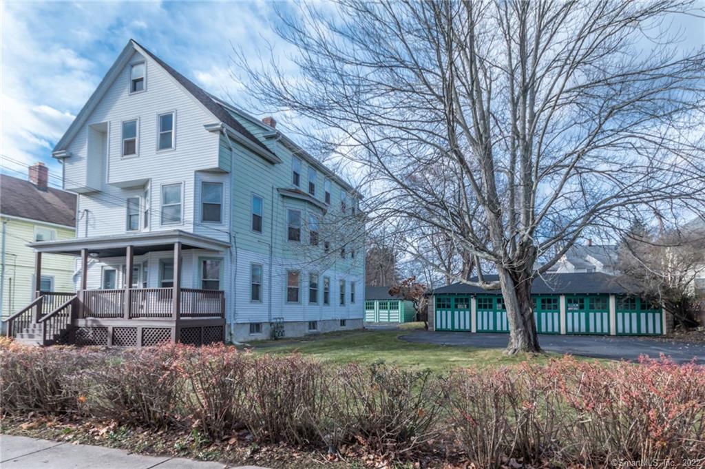 105 Lyons Street New Britain, CT 06052 - Photo 1 of 1 a front view of a house with a yard