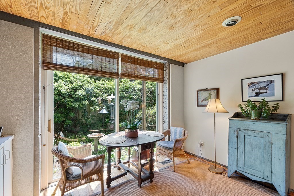 49 Thissell Street Beverly, MA 01915 - Photo 13 of 36 a view of a dining room with furniture window and outside view