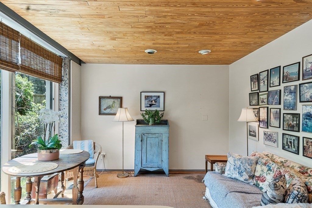 49 Thissell Street Beverly, MA 01915 - Photo 15 of 36 a living room with furniture and a table