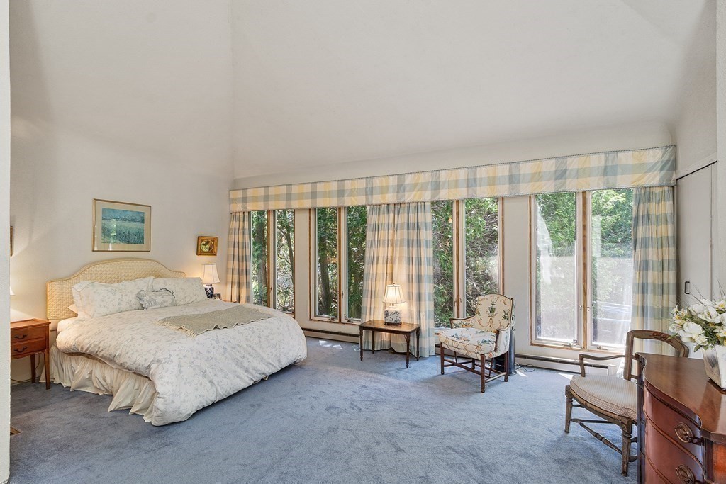 49 Thissell Street Beverly, MA 01915 - Photo 21 of 36 a spacious bedroom with a bed and large window