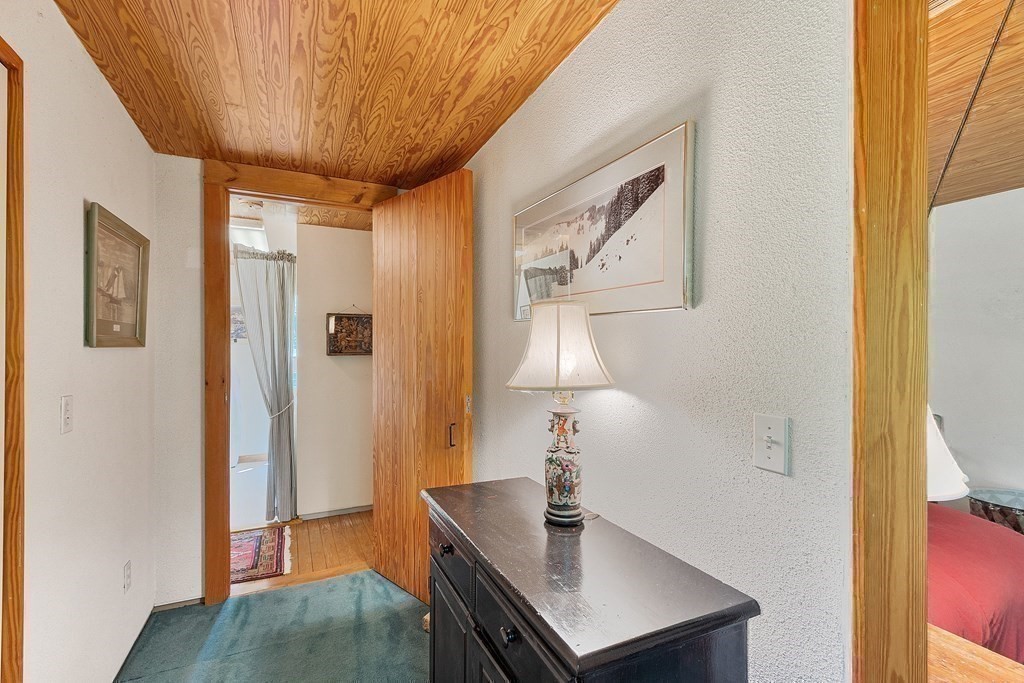 49 Thissell Street Beverly, MA 01915 - Photo 23 of 36 a view of a hallway with entryway wooden floor and front door