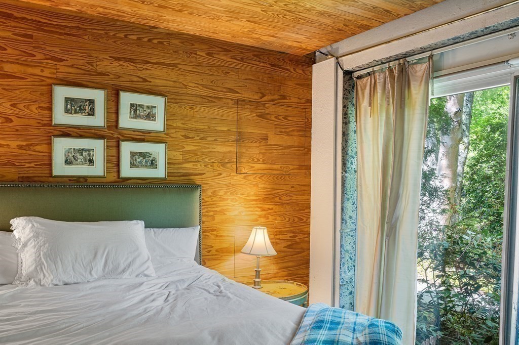 49 Thissell Street Beverly, MA 01915 - Photo 25 of 36 a view of a wooden door and chair