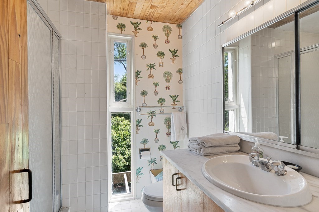 49 Thissell Street Beverly, MA 01915 - Photo 28 of 36 a bathroom with a sink and a mirror