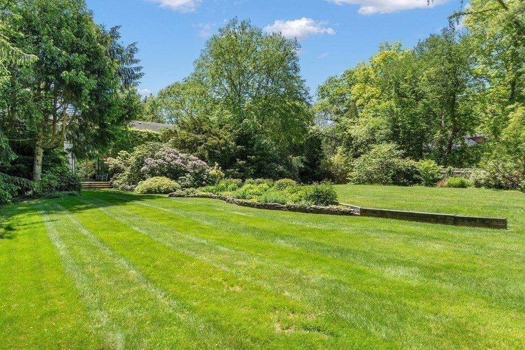 49 Thissell Street Beverly, MA 01915 - Photo 34 of 36 a view of a golf course with a garden