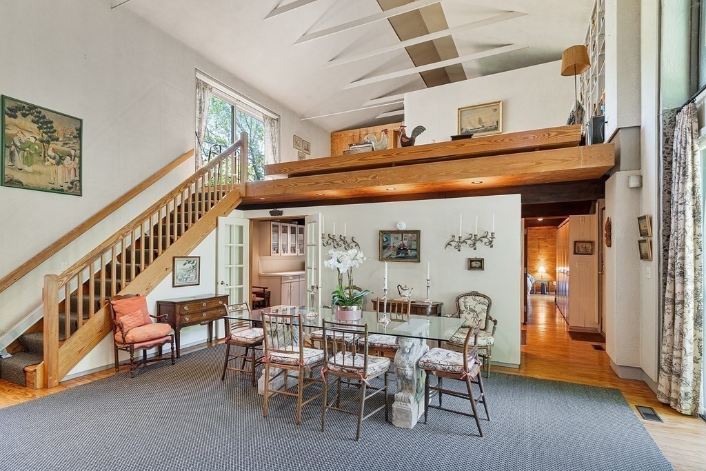 49 Thissell Street Beverly, MA 01915 - Photo 7 of 36 a view of a dining room with furniture and a chandelier