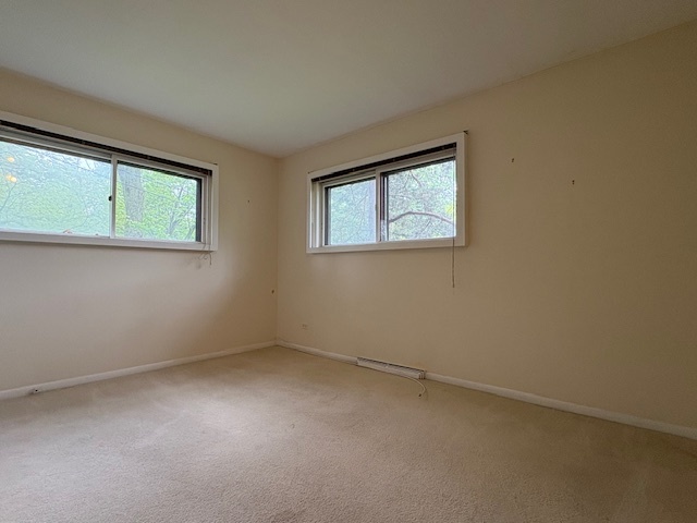 617 Busse Road Mount Prospect, IL 60056 - Photo 12 of 22 an empty room with a window