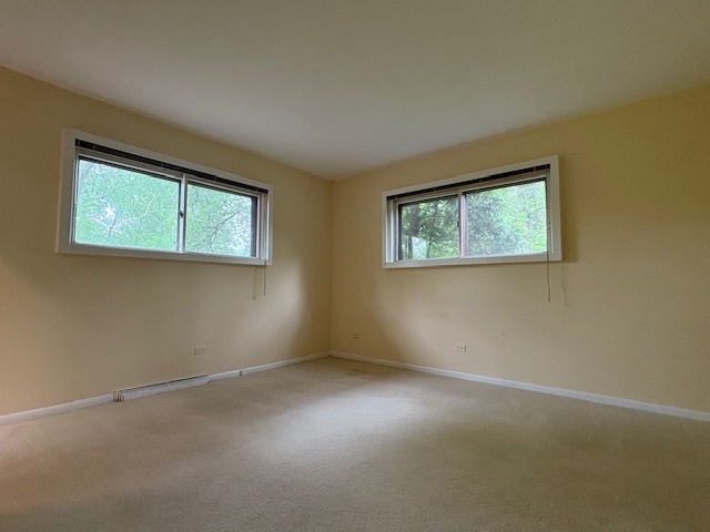 617 Busse Road Mount Prospect, IL 60056 - Photo 13 of 22 an empty room with windows