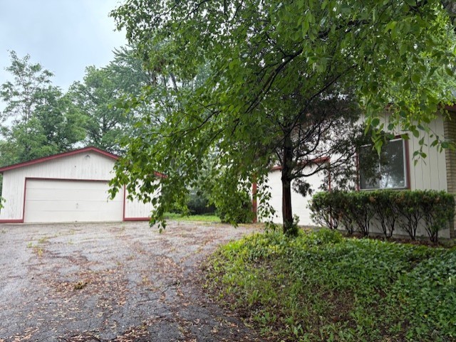 617 Busse Road Mount Prospect, IL 60056 - Photo 19 of 22 a front view of house with a garden