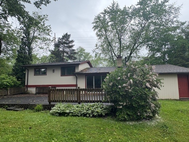 617 Busse Road Mount Prospect, IL 60056 - Photo 20 of 22 a view of a house with a yard plants and large trees