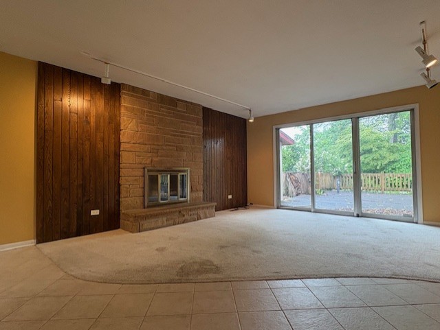 617 Busse Road Mount Prospect, IL 60056 - Photo 2 of 22 a view of an empty room with a fireplace and a large window