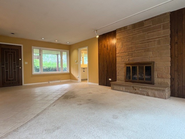 617 Busse Road Mount Prospect, IL 60056 - Photo 3 of 22 an empty room with windows and fireplace
