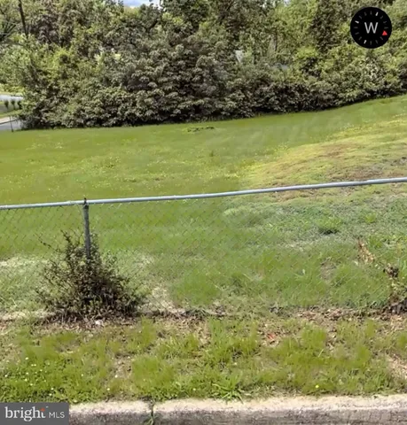 a view of a field with an outdoor space