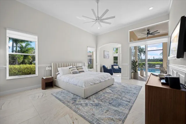 a spacious bedroom with a large bed and a window