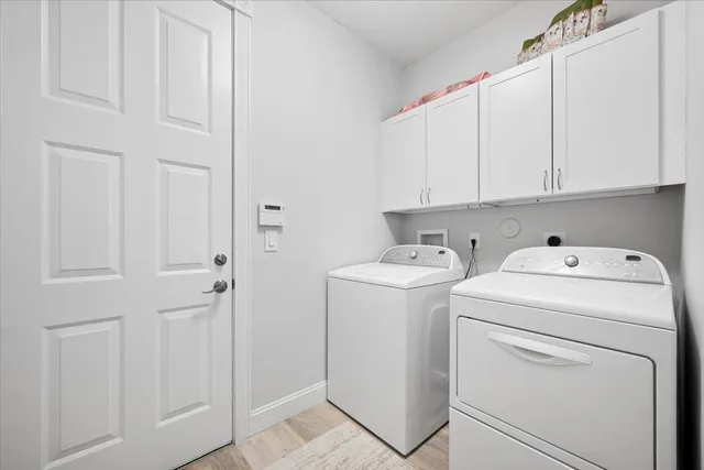 a view of storage and utility room with washer and dryer
