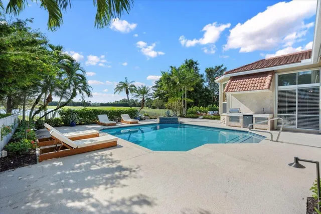 a view of swimming pool with lounge chair