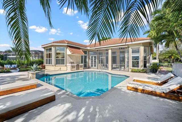 a view of a house with swimming pool and porch with furniture