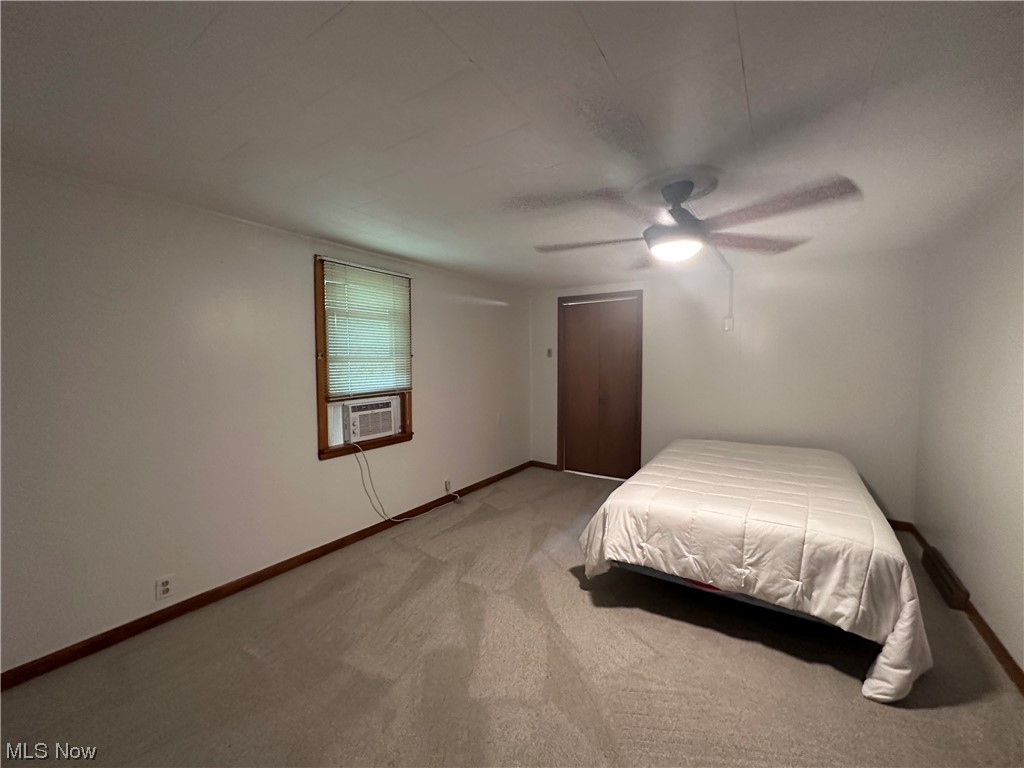 3019 West Poplar Ridge Road Malta, OH 43758 - Photo 5 of 17 Carpeted bedroom featuring ceiling fan