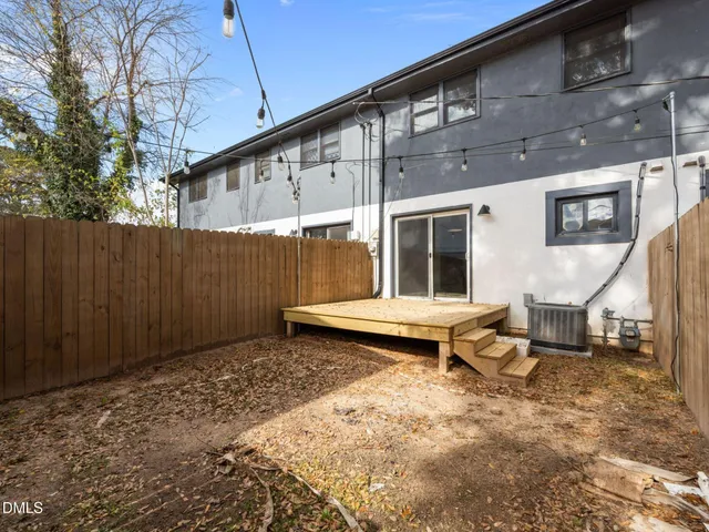 a balcony with table and chairs
