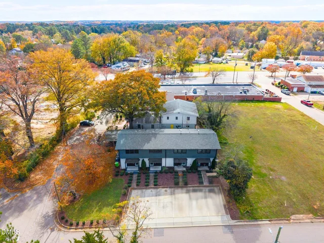 an aerial view of a house with a swimming pool