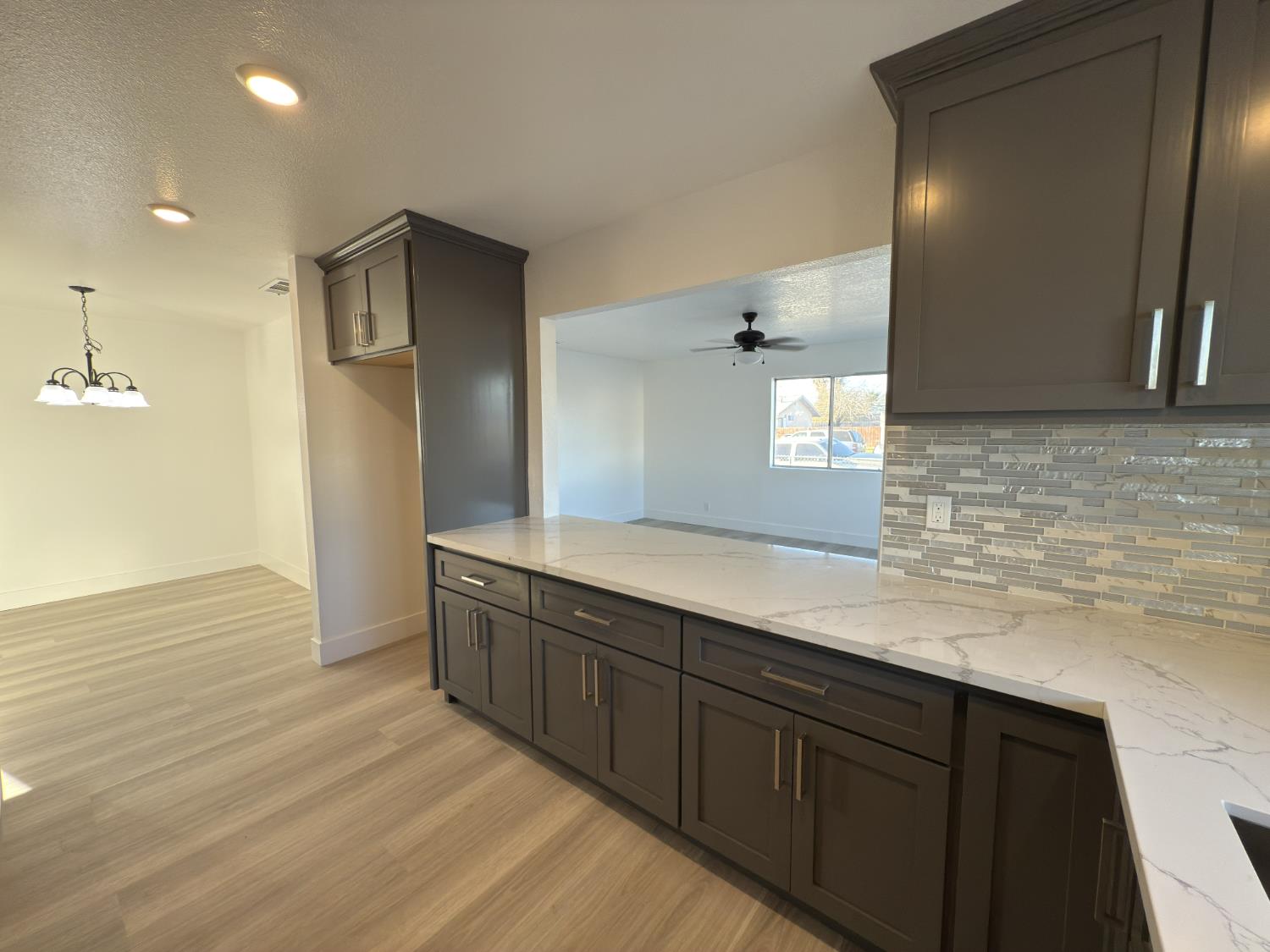21303 South Wyatt Avenue Riverdale, CA 93656 - Photo 7 of 14 a spacious bathroom with a granite countertop sink