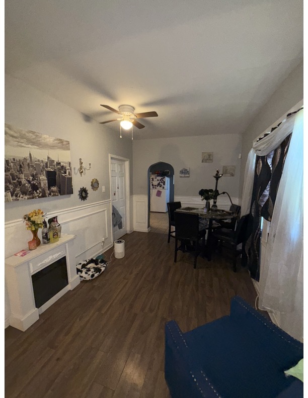 7916 South Normal Avenue Chicago, IL 60620 - Photo 3 of 6 a living room with furniture and a flat screen tv