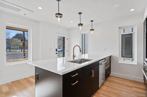 a spacious bathroom with a sink and a mirror