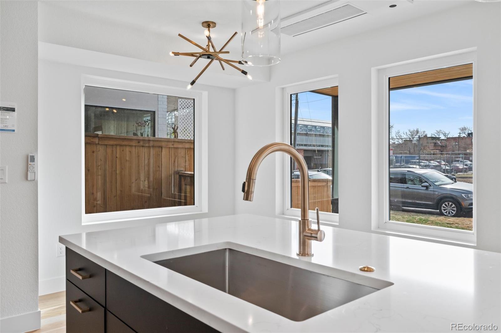 2451 Lawrence Street Denver, CO 80205 - Photo 14 of 48 a kitchen with a sink and a large window
