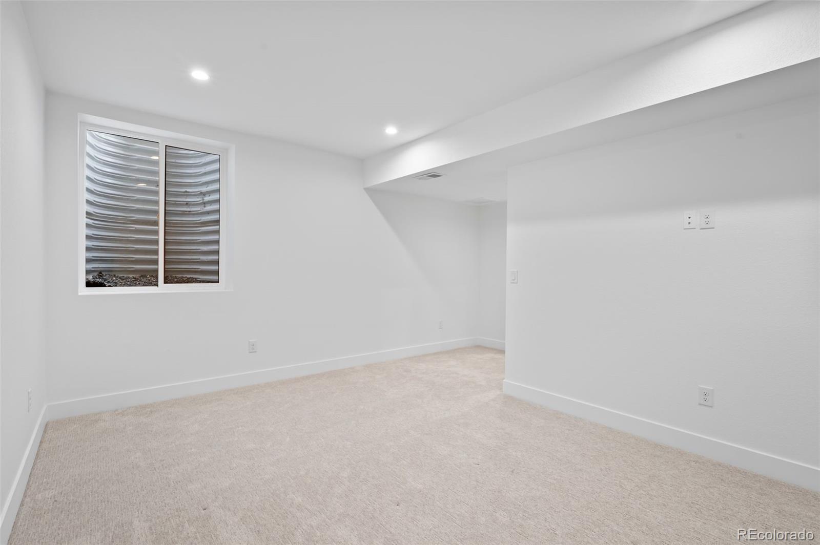 2451 Lawrence Street Denver, CO 80205 - Photo 39 of 48 an empty room with windows