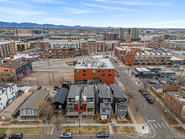 an aerial view of residential houses with outdoor space